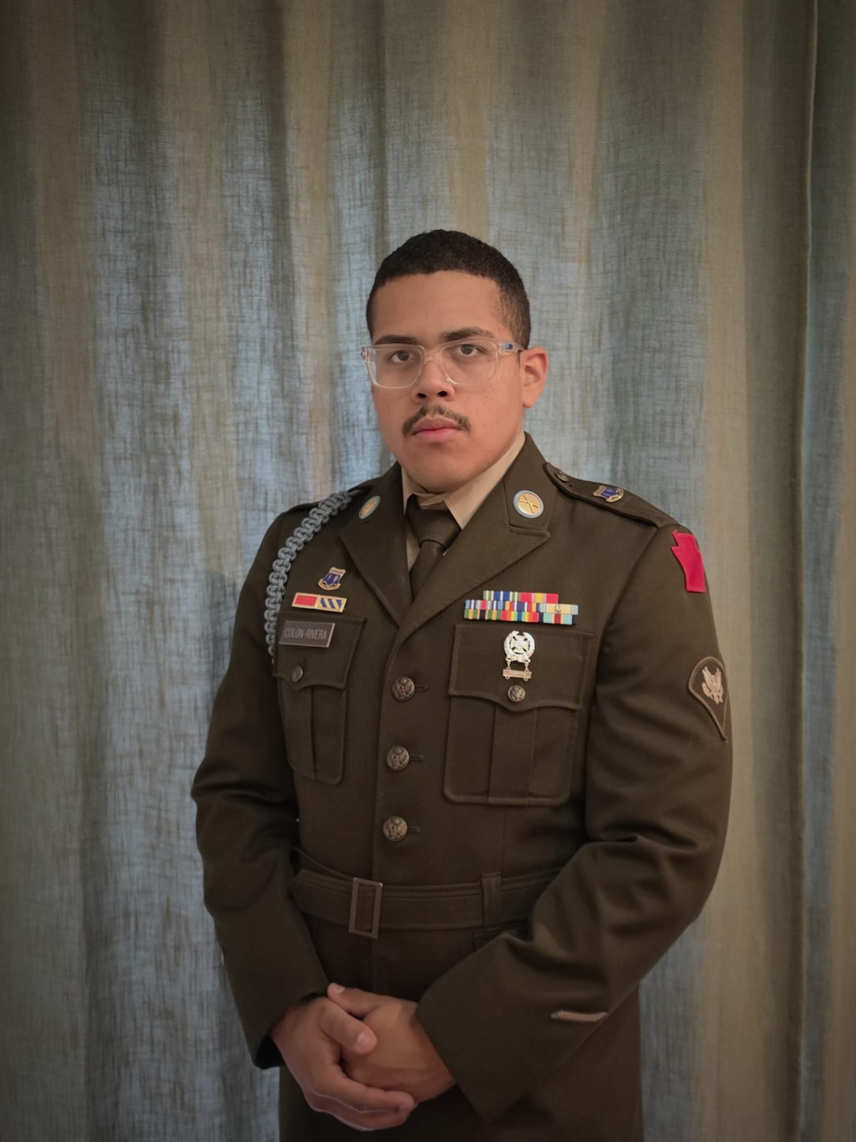 AJ, Founder and CEO of Operating Security Solutions, in U.S. Army dress uniform